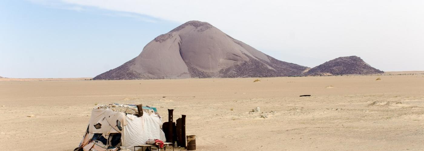 The earth’s third largest monolith captured from third longest train(2.8km). Both located in the “red zone” of Mauritania.