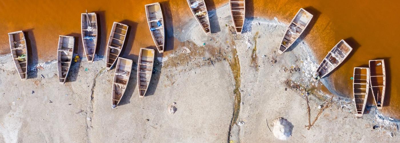 Aerial view of the pink Lake Retba or Lac Rose in Senegal. Salt industry in West Africa